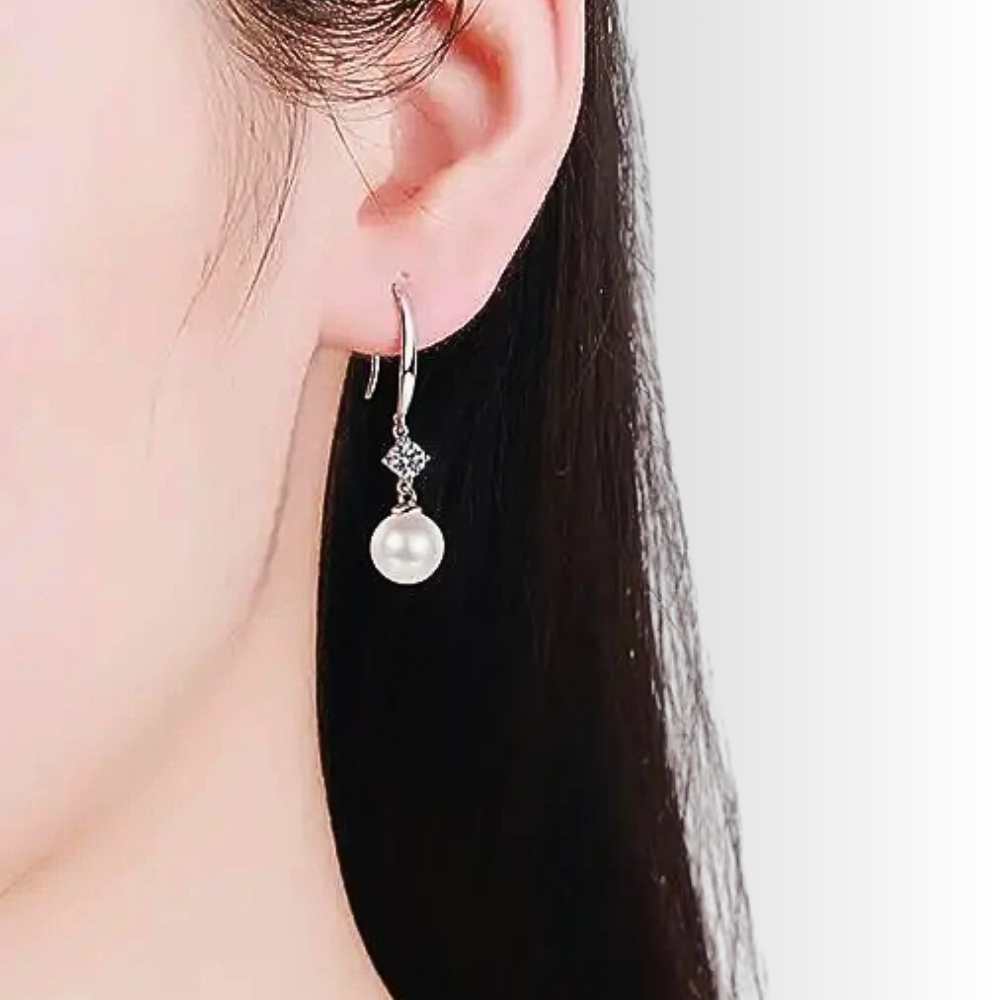 Orecchini con Moissaniti per ct 0,60 e Perle Sferiche