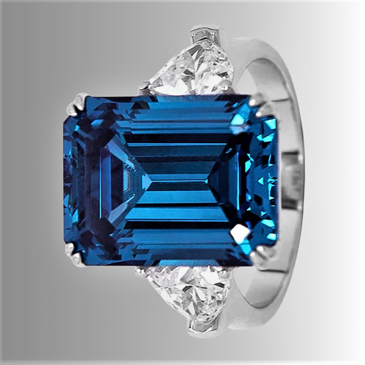 Trilogy con Zaffiro Blu Taglio Smeraldo e Due Diamanti D Color Taglio Trillion Lab Grown