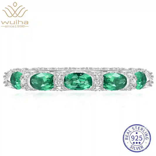 Fedina con Smeraldi Ovali e Brillanti Sintetici Coltivati