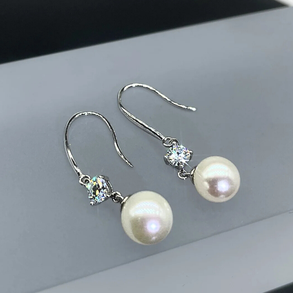 Orecchini con Moissaniti per ct 0,60 e Perle Sferiche