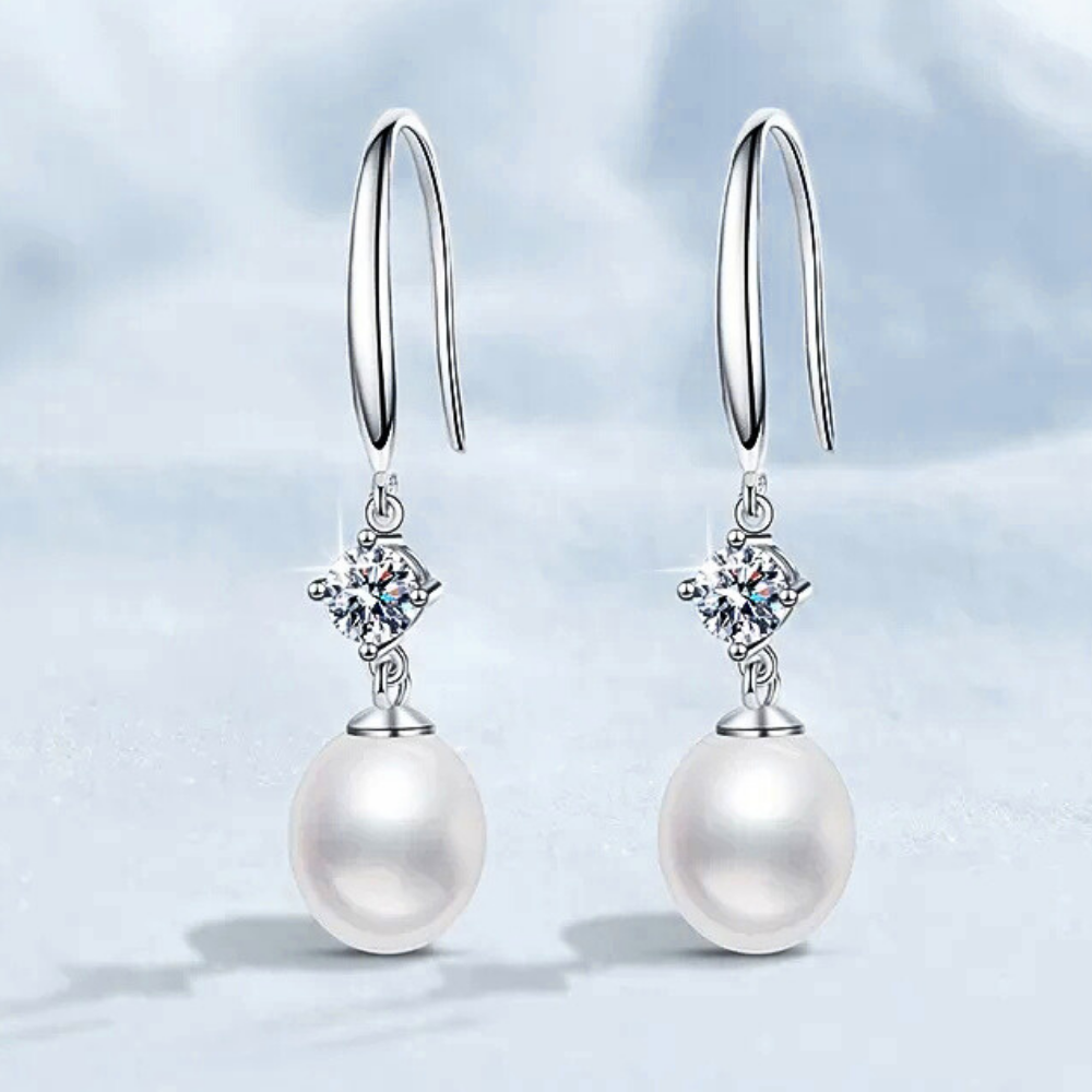 Orecchini con Moissaniti per ct 0,60 e Perle a Goccia