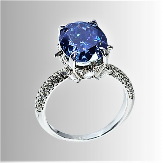 Anello con Moissanite Blu Ovale da 8 Carati: Eleganza Lineare, Profondità Ipnotica