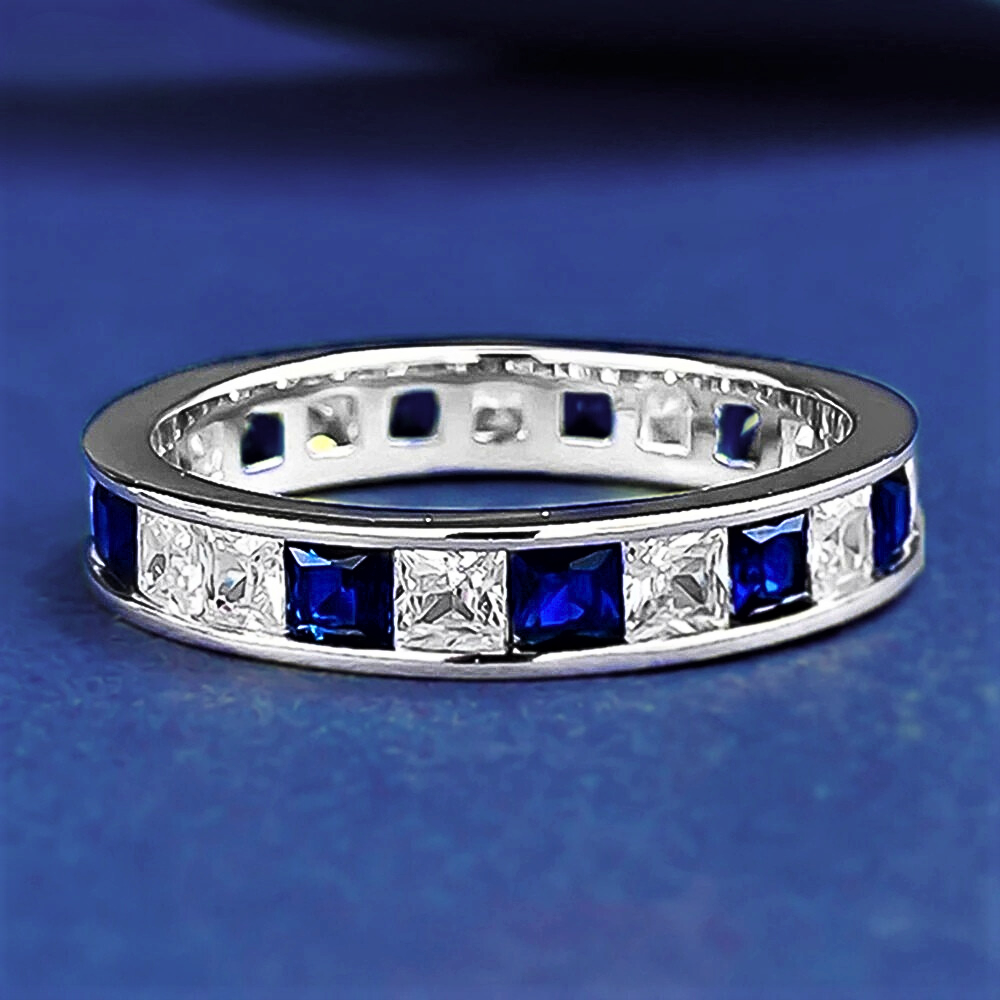Fede Eternity a binario con Zaffiri e Diamanti Sintetici ad Alto Contenuto di Carbonio Taglio Princess