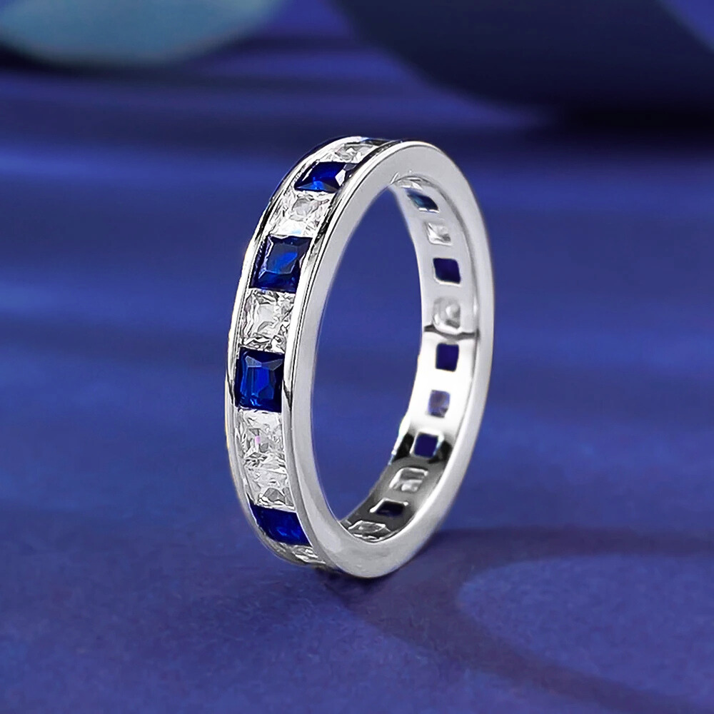 Fede Eternity a binario con Zaffiri e Diamanti Sintetici ad Alto Contenuto di Carbonio Taglio Princess