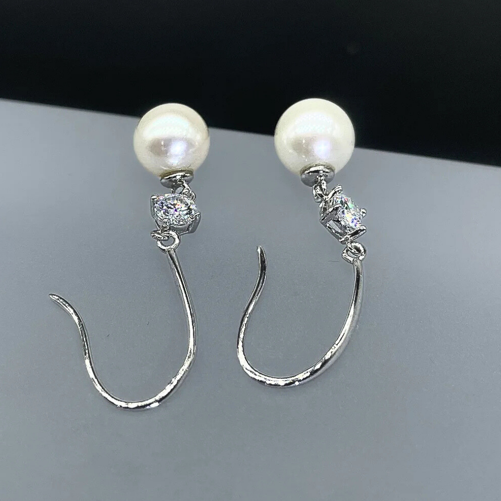 Orecchini con Moissaniti per ct 0,60 e Perle Sferiche