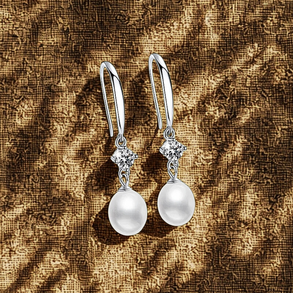 Orecchini con Moissaniti per ct 0,60 e Perle a Goccia