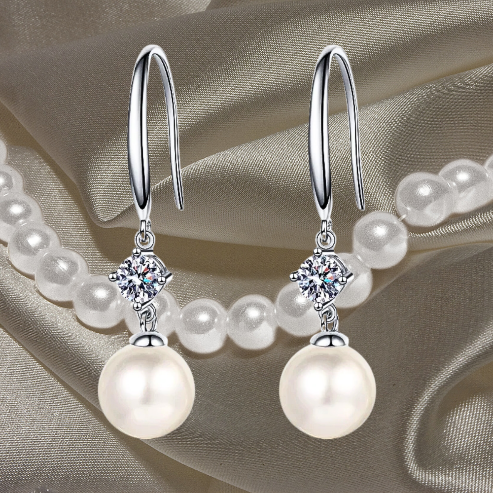 Orecchini con Moissaniti per ct 0,60 e Perle Sferiche