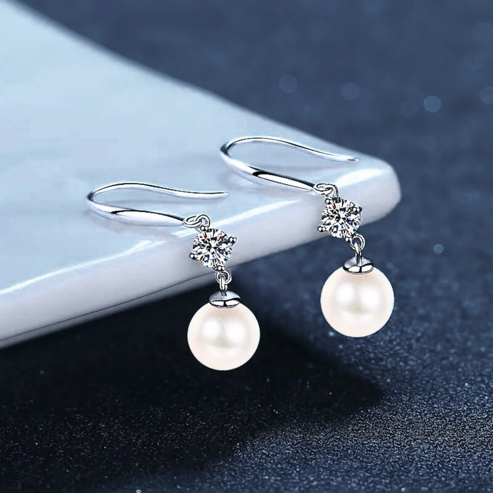 Orecchini con Moissaniti per ct 0,60 e Perle Sferiche