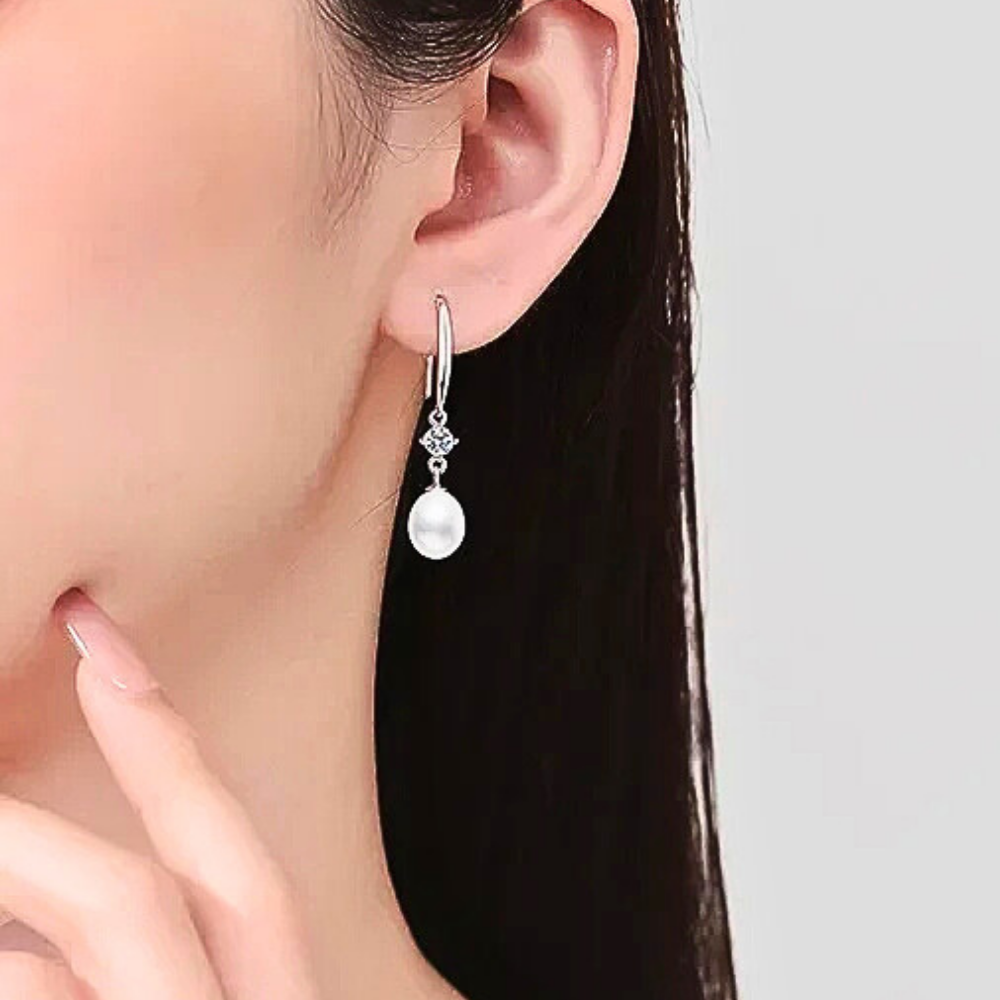 Orecchini con Moissaniti per ct 0,60 e Perle a Goccia