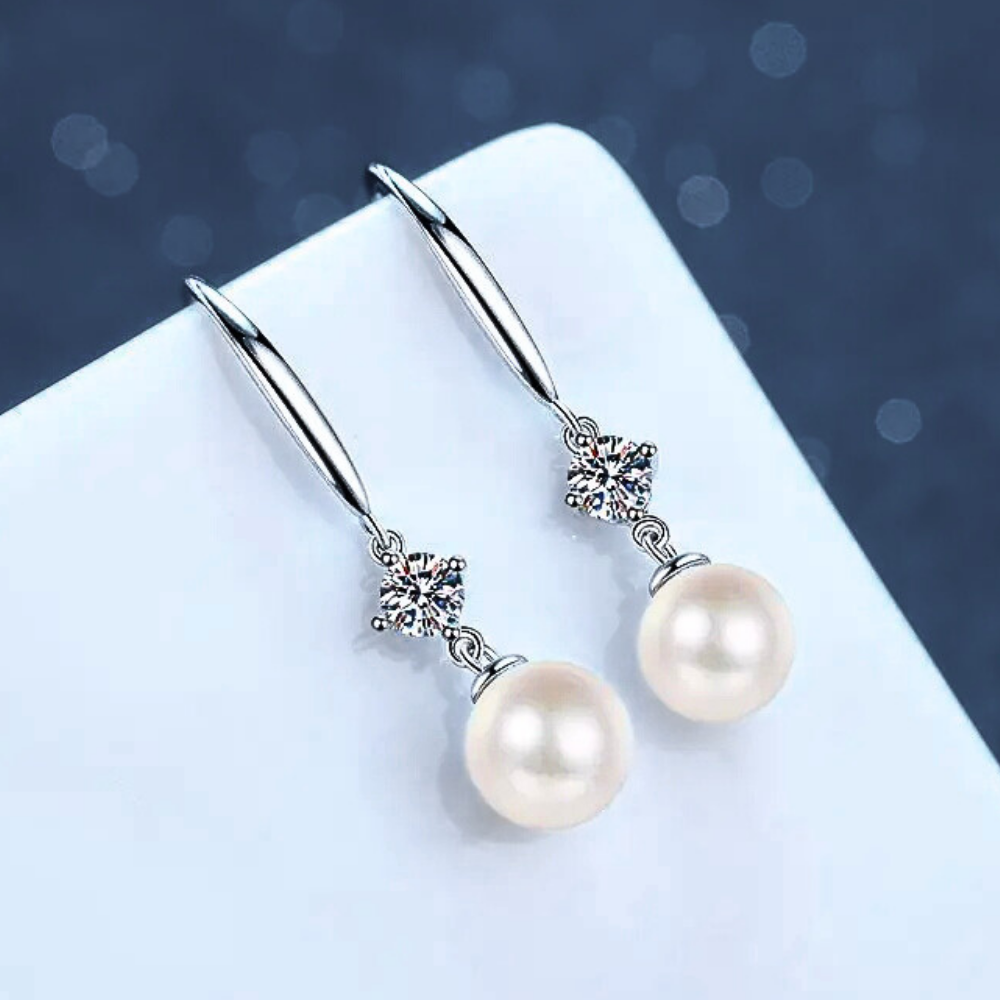 Orecchini con Moissaniti per ct 0,60 e Perle Sferiche