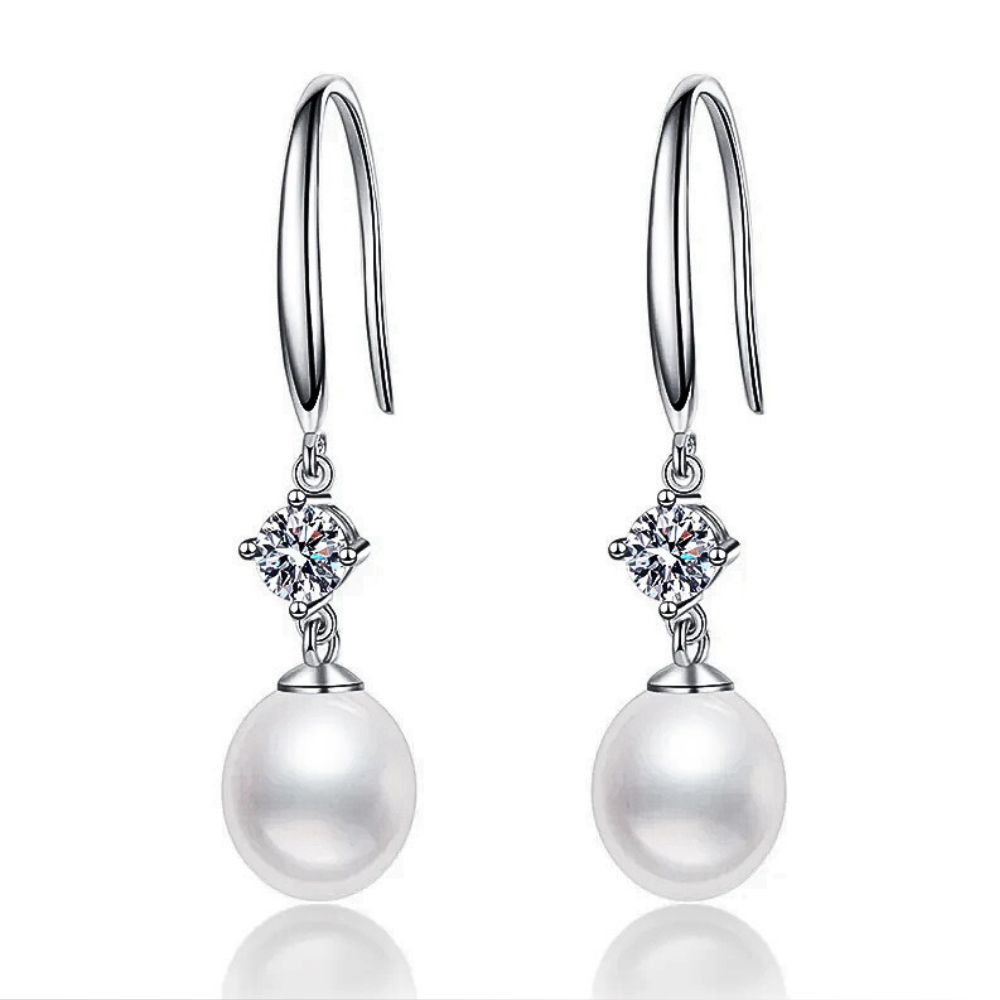 Orecchini con Moissaniti per ct 0,60 e Perle a Goccia