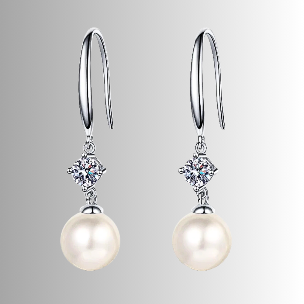 Orecchini con Moissaniti per ct 0,60 e Perle Sferiche